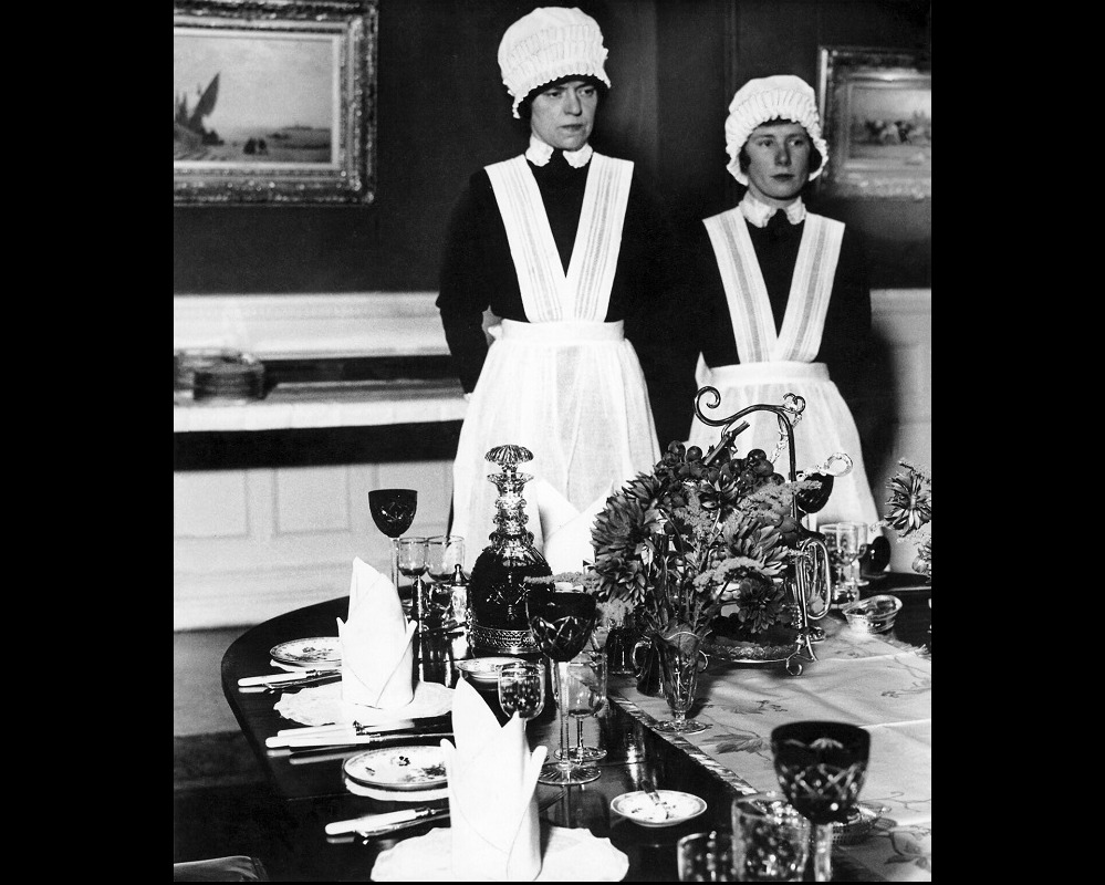 Parlourmaid and Under Parlourmaid ready to serve dinner 1939